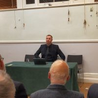 Photo of the Rev. Doug Gay giving the 2025 Congregational Lecture to a room full of people