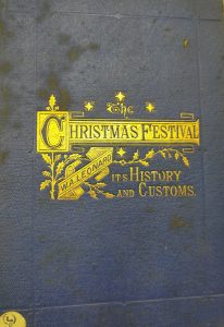 Cover of a blue book with gold writing reading "The Christmas festival: its history and customs"