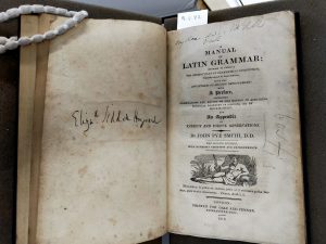 The title page of a manual of Latin grammar written by John Pye Smith, with the name "Eliz[abe]th Siddall Hayward" inscribed opposite