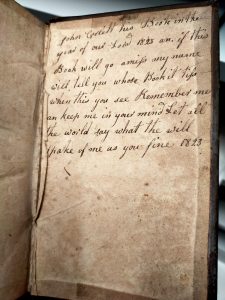 Handwriting on the inside of an old book, dated 1823 and signed "John Coslett"